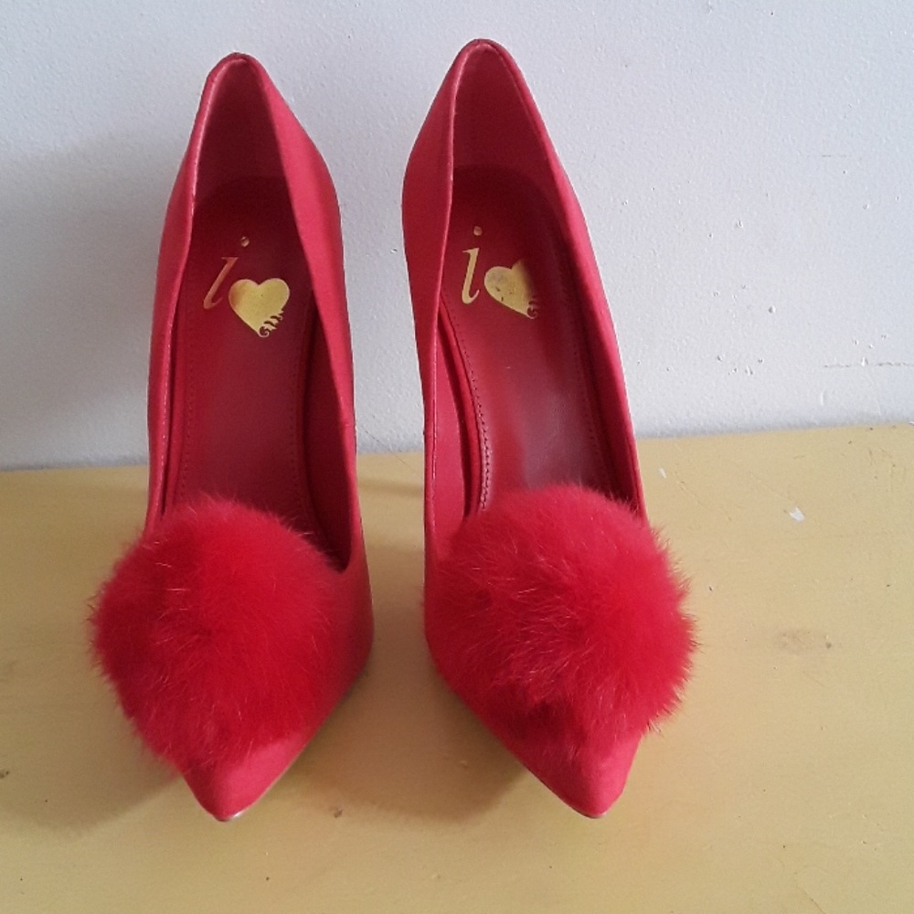 Red pompom pumps